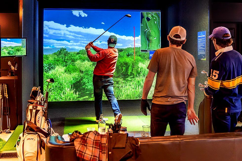 Friends playing virtual golf in Five Iron Golf